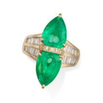 A COLOMBIAN MINOR EMERALD AND DIAMOND DRESS RING set with two pear cut emeralds, the tapering band