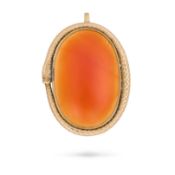 AN ANTIQUE CARNELIAN OUROBOROS PENDANT set with a large cabochon carnelian, framed by an engraved