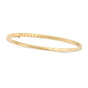 CHOPARD, A GOLD ICE CUBE BANGLE in 18ct yellow gold, designed as a row of stylised ice cubes, signed