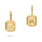 LUGANO, A PAIR OF 6.02 CARAT FANCY YELLOW DIAMOND DROP EARRINGS each suspending a cushion cut yellow
