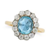 AN ANTIQUE AQUAMARINE AND DIAMOND CLUSTER RING set with an oval cut aquamarine of approximately 1.71