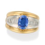 A SAPPHIRE AND DIAMOND DRESS RING set with an oval cut sapphire of 1.98 carats accented by a row