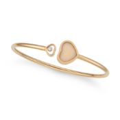 CHOPARD, A PINK OPAL AND DIAMOND HAPPY HEARTS BANGLE in 18ct yellow gold, the open cuff bangle termi