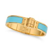 HERMÈS, AN ENAMEL CHARNIERE HINGED BRACELET in gold plated metal with blue enamel inlay and a hinged
