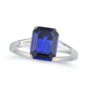 NO RESERVE - A FINE SAPPHIRE AND DIAMOND THREE STONE RING set with an octagonal step cut sapphire of