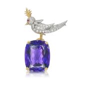 SCHLUMBERGER FOR TIFFANY & CO., AN AMETHYST, DIAMOND AND RUBY BIRD ON A ROCK BROOCH in 18ct yellow g