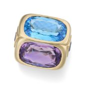 MARINA B, A BLUE TOPAZ AND AMETHYST TWIN RING in 18ct yellow gold and white gold, set with a cushion