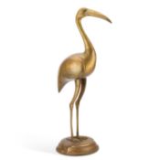 A LARGE BRASS MODEL OF A STANDING CRANE OR HERON