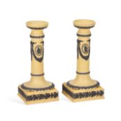 A PAIR OF WEDGWOOD YELLOW GROUND CANDLESTICKS, C.1900