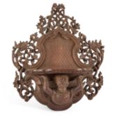 AN ANGLO-BURMESE CARVED WOOD WALL BRACKET CIRCA 1900