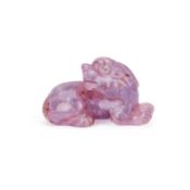A CHINESE AMETHYST CARVED LION DOG