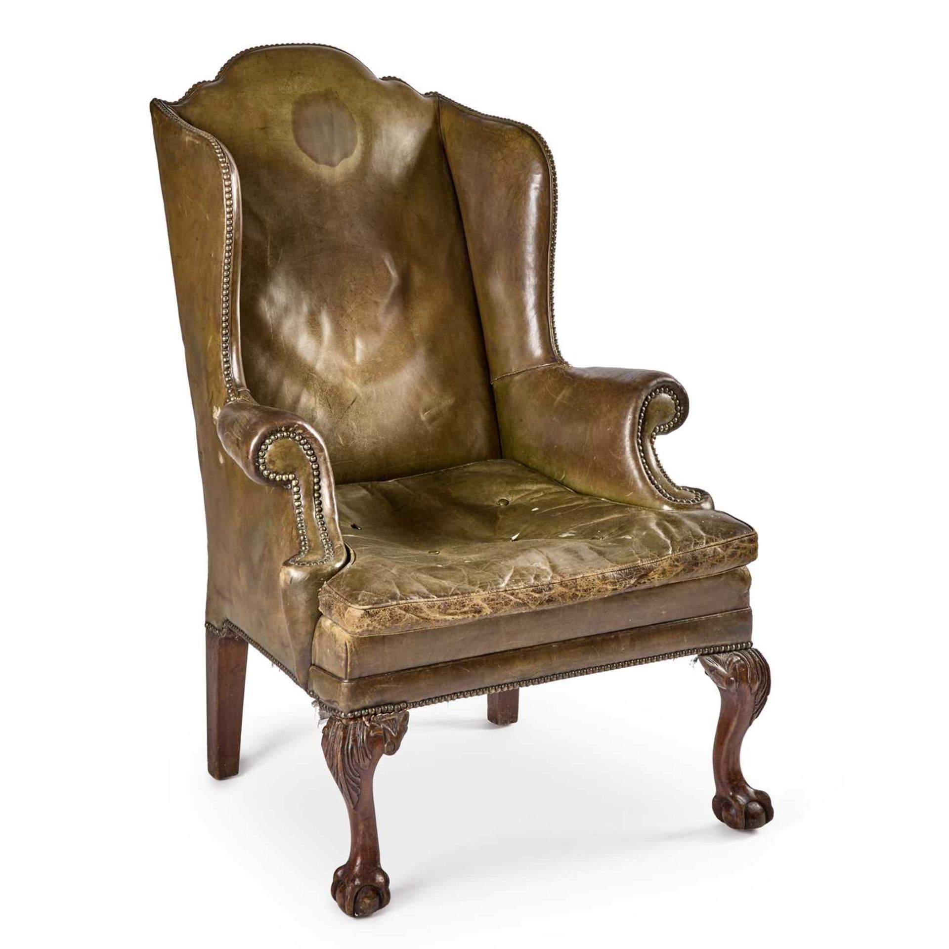 A GEORGE II STYLE LEATHER WING ARMCHAIR