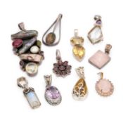 A COLLECTION OF SILVER GEM-SET PENDANTS