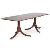 A REGENCY STYLE MAHOGANY TWIN-PEDESTAL DINING TABLE STAMPED J.H. COOPER & SON, ILKLEY