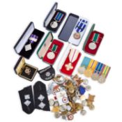 A COLLECTION OF MEDALS AND BADGES