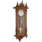 A LATE 19TH CENTURY WALNUT VIENNA WALL CLOCK