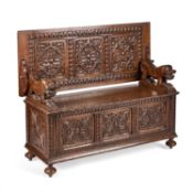 A VICTORIAN CARVED OAK MONKS BENCH