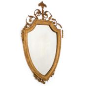 A LATE 19TH CENTURY GILTWOOD AND COMPOSITION CARTOUCHE-SHAPED WALL MIRROR