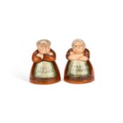 A PAIR OF ROYAL DOULTON FIGURAL SALT AND PEPPER POTS 'VOTES FOR WOMEN' AND 'TOIL FOR MEN'