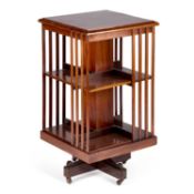 AN EDWARDIAN INLAID MAHOGANY REVOLVING BOOKCASE