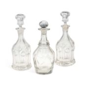 THREE 19TH CENTURY GLASS DECANTERS AND STOPPERS