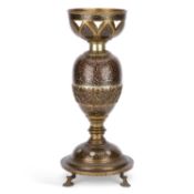 A LATE 19TH/ EARLY 20TH CENTURY INDIAN BRASS AND DAMASCENED OIL LAMP BASE