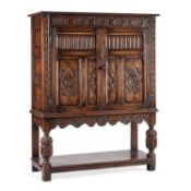 A PERIOD STYLE OAK CUPBOARD