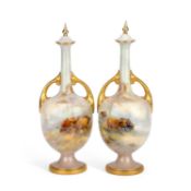 A PAIR OF ROYAL WORCESTER TWO-HANDLED VASES AND COVERS