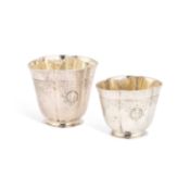 A GRADUATED PAIR OF EARLY 18TH CENTURY GERMAN SILVER STACKING BEAKERS