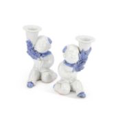 A PAIR OF JAPANESE HIRADO PORCELAIN FIGURAL CANDLESTICKS LATE 19TH/ EARLY 20TH CENTURY