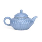 A CHINESE PALE BLUE-GLAZED TEAPOT AND COVER