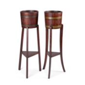A NEAR PAIR OF EDWARDIAN OAK PLANTERS BY LISTER