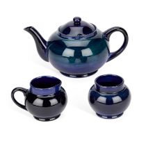 A MOORCROFT POTTERY THREE-PIECE TEA SERVICE