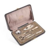 A GEORGE VI SILVER-MOUNTED MANICURE SET