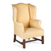 A GEORGE III STYLE MAHOGANY AND UPHOLSTERED WING-BACK ARMCHAIR