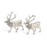 A PAIR OF SILVER-PLATED SALT AND PEPPER POTS