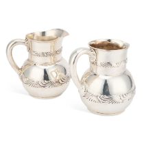 A NEAR PAIR OF AMERICAN SILVER WATER JUGS