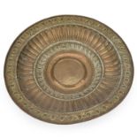 A LARGE BRASS ALMS DISH 19TH CENTURY OR EARLIER