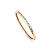 AN EMERALD AND DIAMOND HINGE OPENING BANGLE