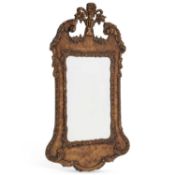 A GEORGIAN STYLE PARCEL-GILT MIRROR