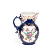 A WORCESTER BLUE GROUND CABBAGE LEAF MASK JUG CIRCA 1770
