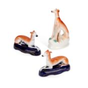 A PAIR OF VICTORIAN STAFFORDSHIRE POTTERY GREYHOUND PEN STANDS