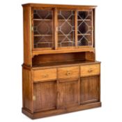 AN EARLY 20TH CENTURY OAK AND LEAD-GLAZED BOOKCASE CABINET