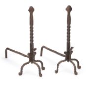 A PAIR OF ARTS AND CRAFTS WROUGHT IRON FIREDOGS