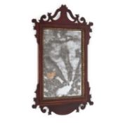 A GEORGE III STYLE MAHOGANY FRETWORK MIRROR AND A VICTORIAN GILTWOOD MIRROR