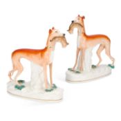A PAIR OF VICTORIAN STAFFORDSHIRE POTTERY GREYHOUND COURSING FIGURES
