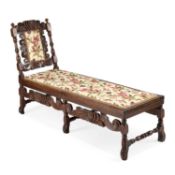 A CAROLEAN STYLE CARVED OAK DAY BED 19TH CENTURY