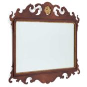 A GEORGIAN STYLE MAHOGANY FRETWORK MIRROR LABEL OF TITCHMARSH & GOODWIN