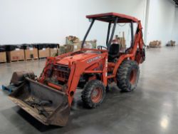 1998 Kubota L35 with a backhoe with 3 buckets (18", 2' and 3'), tiller, box scraper and mower with 1