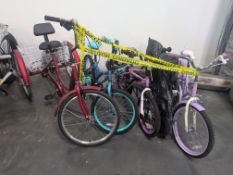 Four kids bikes and tricycle